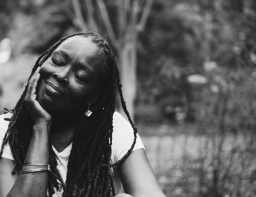 Lady with locs black and white